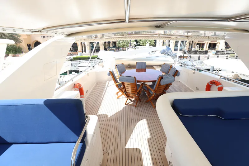  Yacht Photos Pics Luxurious 1999 Codecasa 105 Custom yacht deck with seating and dining area.