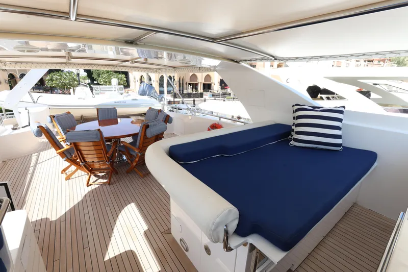  Yacht Photos Pics Luxurious 1999 Codecasa 105 Custom yacht deck with seating and dining area.