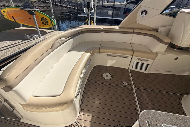  Yacht Photos Pics 2014 Sea Ray 370 Sundancer interior with beige seating and teak flooring.