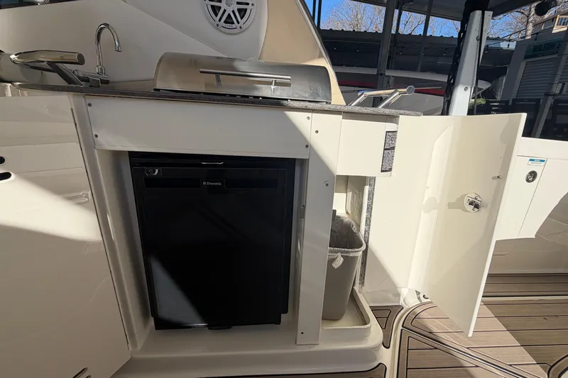  Yacht Photos Pics 2014 Sea Ray 370 Sundancer boat kitchen with sink, grill, and storage.