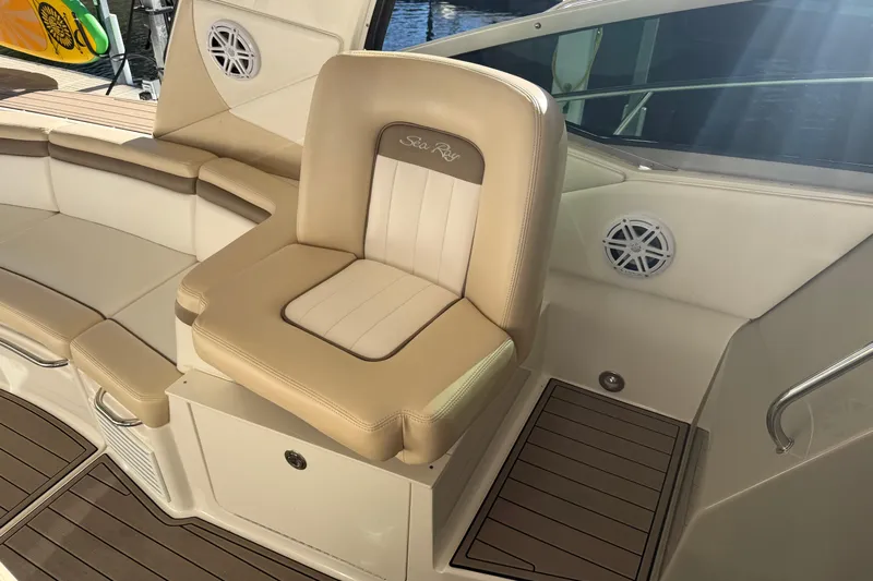  Yacht Photos Pics Luxury seating on 2014 Sea Ray 370 Sundancer boat, featuring beige upholstery and wood accents.