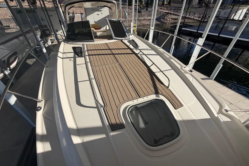 Yacht Photos Pics 2014 Sea Ray 370 Sundancer yacht with spacious deck and sleek design in marina.