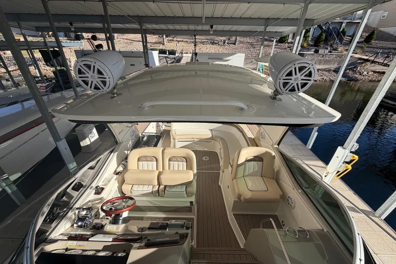  Yacht Photos Pics 2014 Sea Ray 370 Sundancer boat interior with beige seating and modern dashboard.