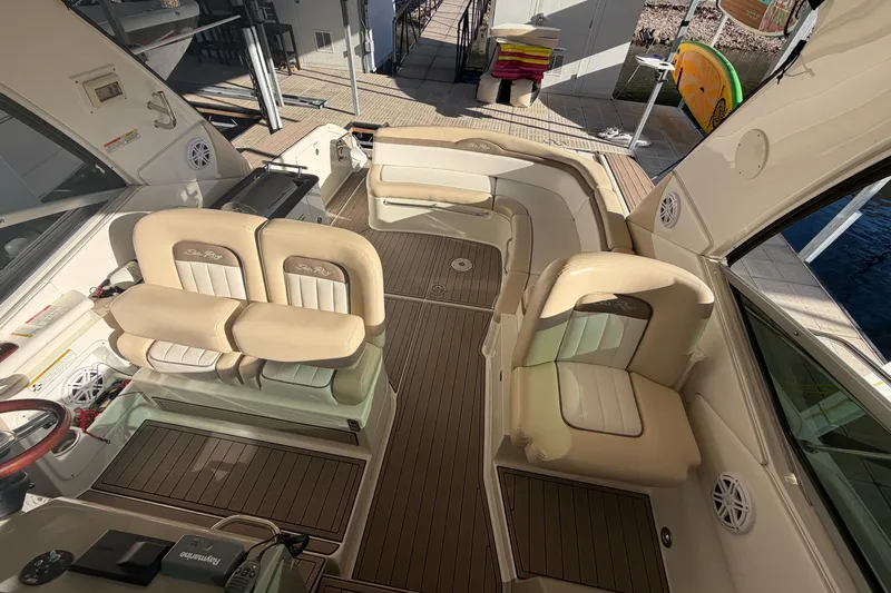  Yacht Photos Pics 2014 Sea Ray 370 Sundancer interior with beige seating and wood flooring.
