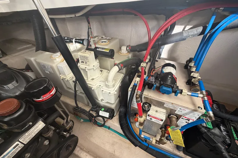  Yacht Photos Pics Engine compartment of a 2014 Sea Ray 370 Sundancer with visible mechanical components.