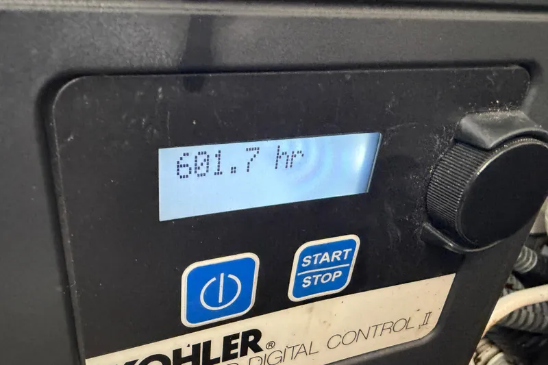  Yacht Photos Pics Kohler digital control panel showing 601.7 hours on a 2014 Sea Ray 370 Sundancer.