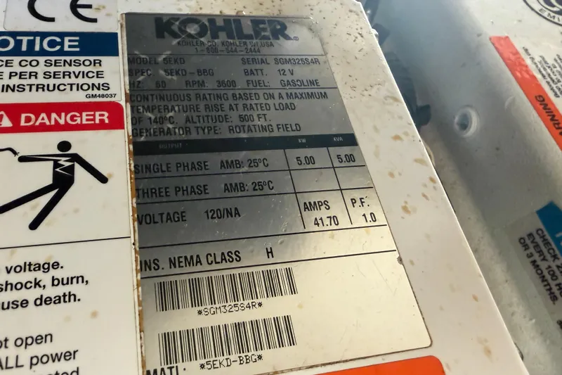  Yacht Photos Pics Kohler generator label on 2014 Sea Ray 370 Sundancer, showing specifications and safety warnings.