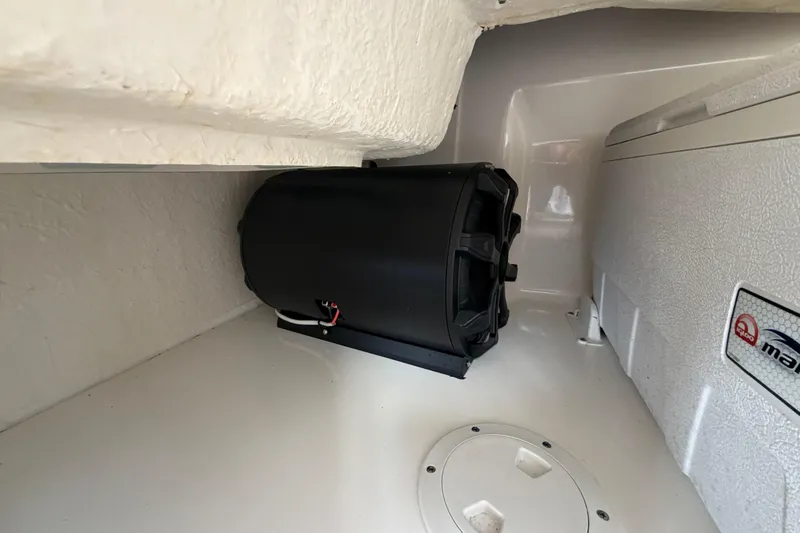  Yacht Photos Pics 2014 Sea Ray 370 Sundancer interior with black speaker and storage compartment.