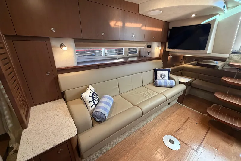  Yacht Photos Pics Luxurious interior of 2014 Sea Ray 370 Sundancer yacht with leather seating and modern amenities.