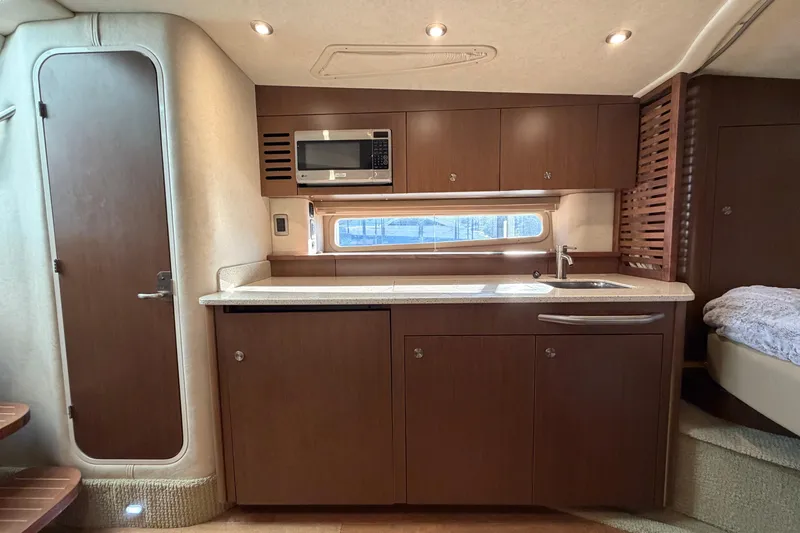  Yacht Photos Pics Interior of 2014 Sea Ray 370 Sundancer yacht with modern kitchen amenities.