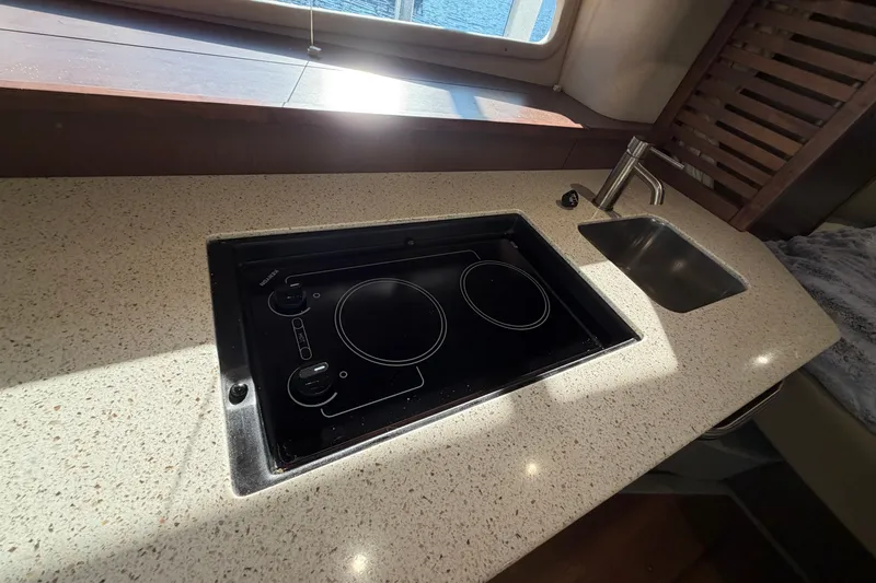 Yacht Photos Pics 2014 Sea Ray 370 Sundancer galley with electric cooktop and sink.