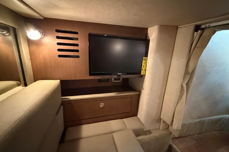  Yacht Photos Pics Interior of 2014 Sea Ray 370 Sundancer with TV and wooden cabinetry.