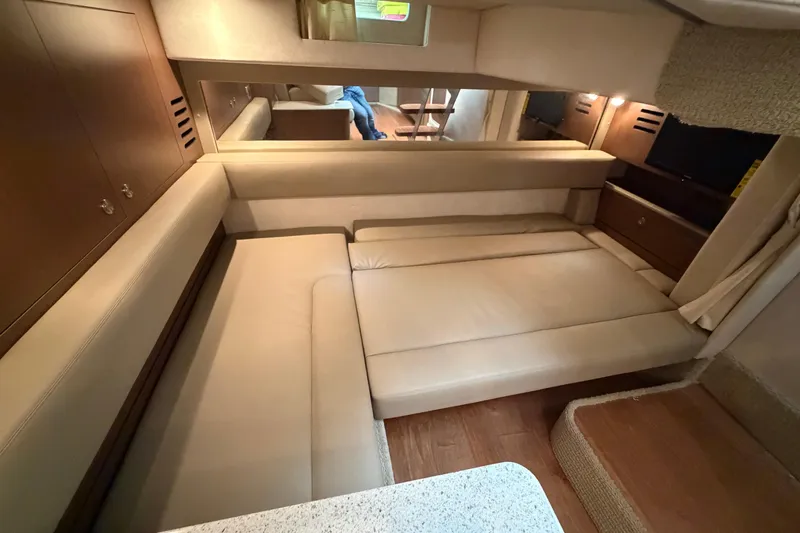  Yacht Photos Pics Interior of 2014 Sea Ray 370 Sundancer with beige seating and wooden accents.