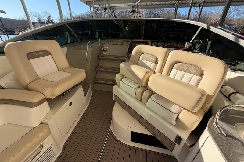  Yacht Photos Pics 2014 Sea Ray 370 Sundancer cockpit with beige seating and helm controls.