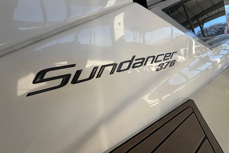  Yacht Photos Pics 2014 Sea Ray 370 Sundancer boat logo on white hull.