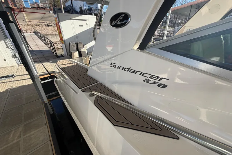  Yacht Photos Pics 2014 Sea Ray 370 Sundancer docked, showcasing sleek design and branding.