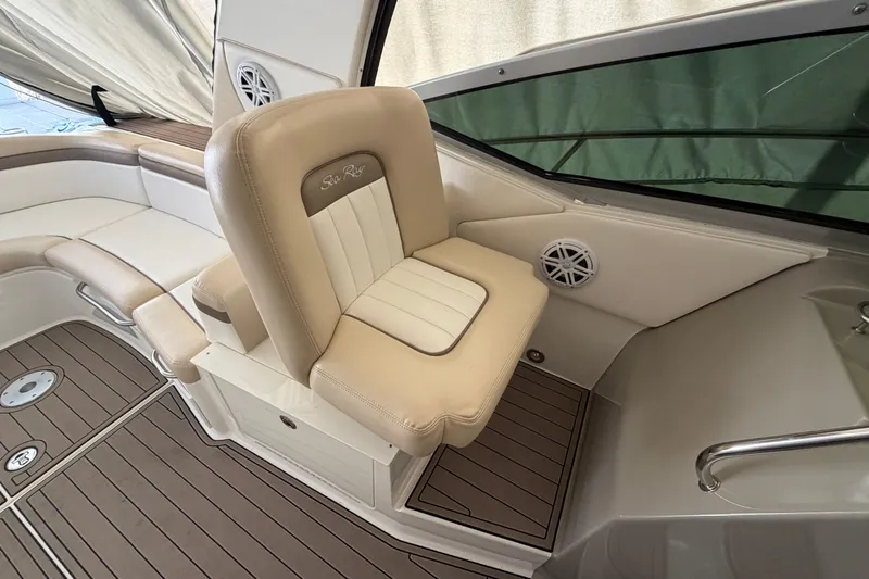  Yacht Photos Pics 2014 Sea Ray 370 Sundancer cockpit with beige seating and wood-style flooring.