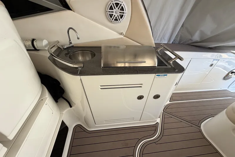  Yacht Photos Pics Outdoor kitchenette on 2014 Sea Ray 370 Sundancer yacht with sink and grill.