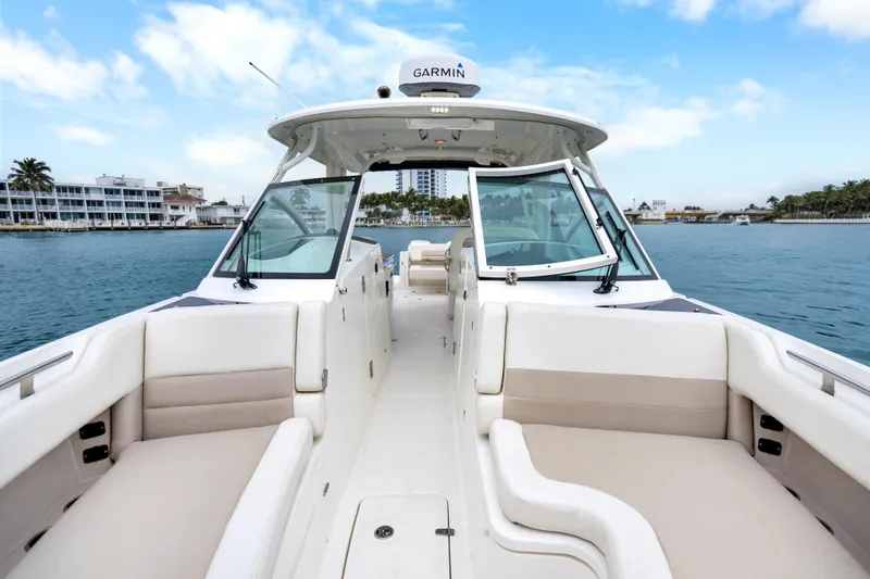  Yacht Photos Pics 2018 Boston Whaler 320 Vantage boat interior with open seating and waterfront view.