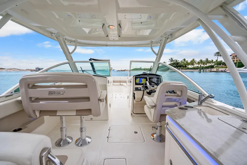  Yacht Photos Pics 2018 Boston Whaler 320 Vantage boat interior with helm, seating, and ocean view.