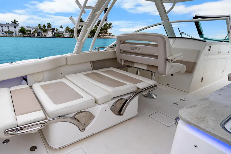 Yacht Photos Pics 2018 Boston Whaler 320 Vantage interior with luxurious seating and scenic waterfront view.