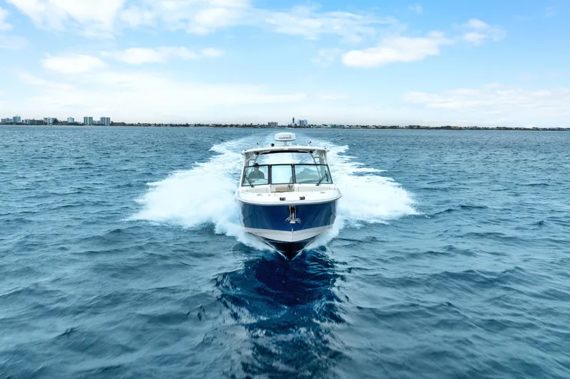  Yacht Photos Pics 2018 Boston Whaler 320 Vantage cruising on open water under a clear sky.