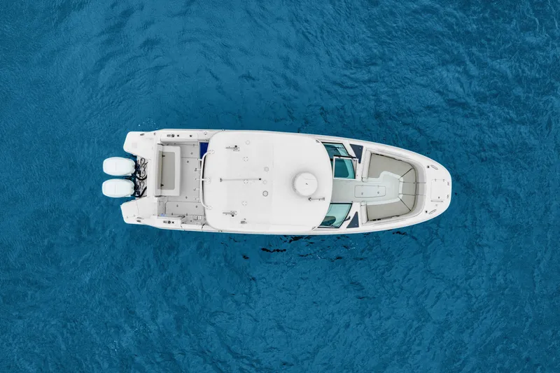  Yacht Photos Pics Aerial view of 2018 Boston Whaler 320 Vantage boat on blue ocean water.