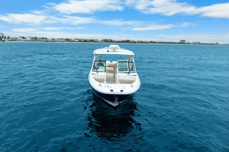  Yacht Photos Pics 2018 Boston Whaler 320 Vantage boat on open blue sea under clear sky.