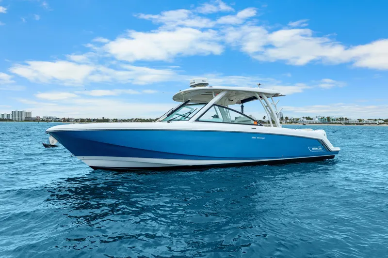  Yacht Photos Pics 2018 Boston Whaler 320 Vantage boat on blue ocean under clear sky.