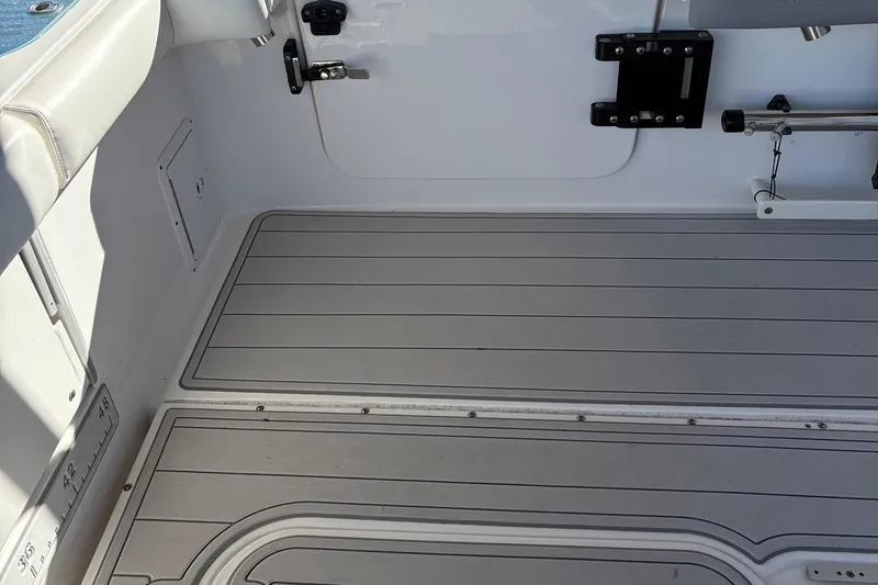 In Absentia Yacht Photos Pics Interior view of 2017 Everglades 350LX boat, featuring clean deck and seating area.