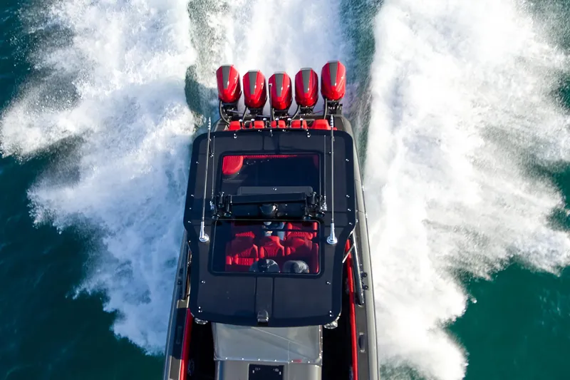  Yacht Photos Pics Aerial view of 2021 Midnight Express 43' Solstice speedboat with powerful engines on water.