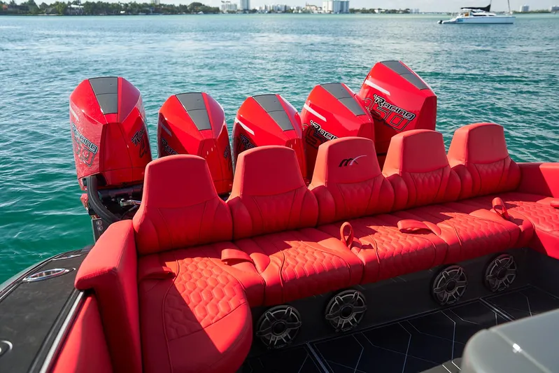  Yacht Photos Pics Red seating and engines on a 2021 Midnight Express 43' Solstice boat, on the water.