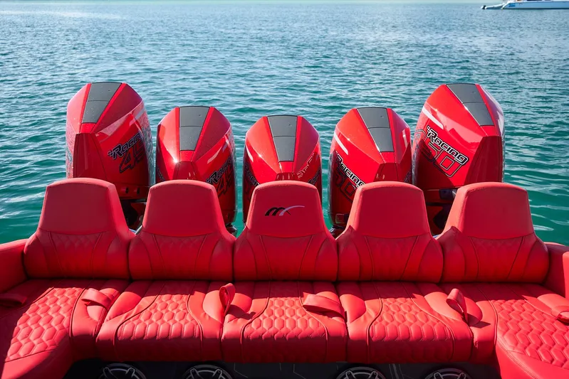  Yacht Photos Pics Red seats and engines on a 2021 Midnight Express 43' Solstice boat, on calm water.
