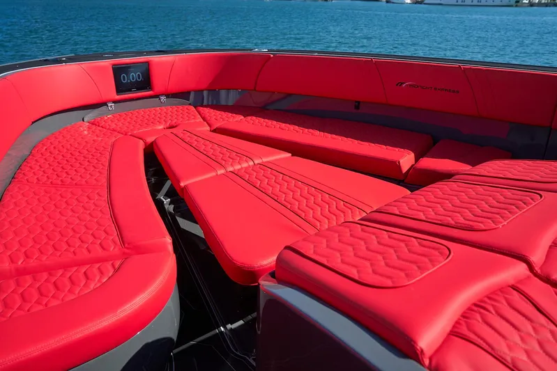  Yacht Photos Pics Luxurious red seating on 2021 Midnight Express 43' Solstice boat, with ocean backdrop.