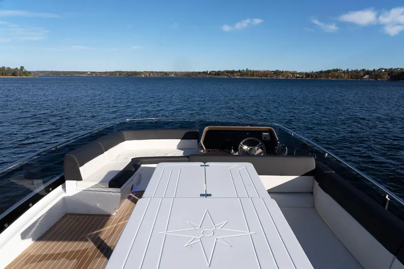  Yacht Photos Pics 2024 Galeon 440 Fly yacht with spacious deck, cruising on a serene lake.