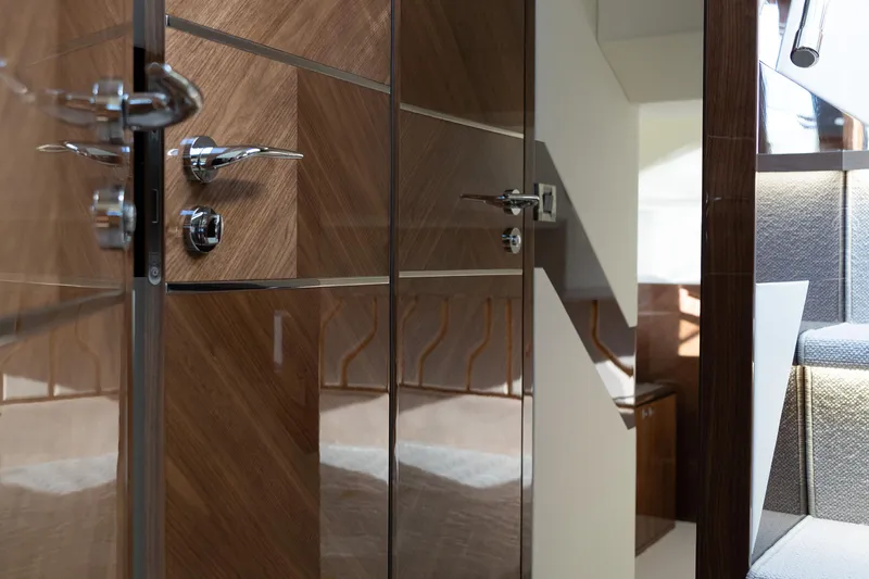  Yacht Photos Pics Luxurious interior of 2024 Galeon 440 Fly yacht, featuring sleek wood paneling and modern design.