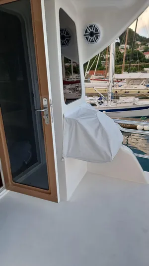  Yacht Photos Pics 2009 Bertram 700 Enclosed yacht deck with door and covered equipment.