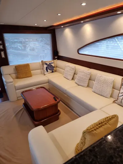  Yacht Photos Pics Luxurious interior of a 2009 Bertram 700 Enclosed yacht with plush seating.