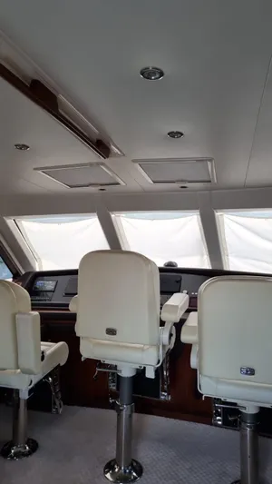  Yacht Photos Pics Interior of 2009 Bertram 700 Enclosed yacht with white captain chairs.