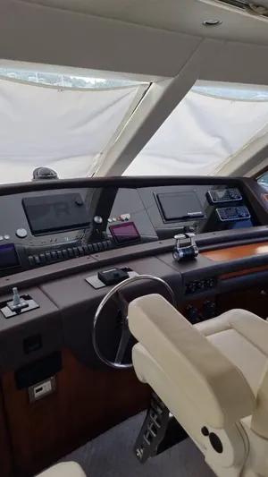  Yacht Photos Pics 2009 Bertram 700 Enclosed yacht helm with advanced navigation systems and luxurious seating.