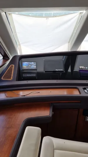  Yacht Photos Pics Interior dashboard of a 2009 Bertram 700 Enclosed yacht with navigation equipment.