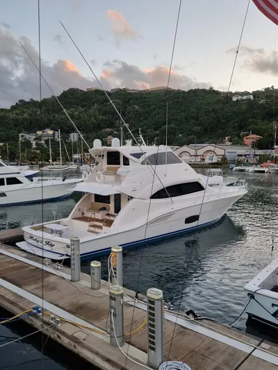  Yacht Photos Pics 2009 Bertram 700 Enclosed yacht docked at a marina.