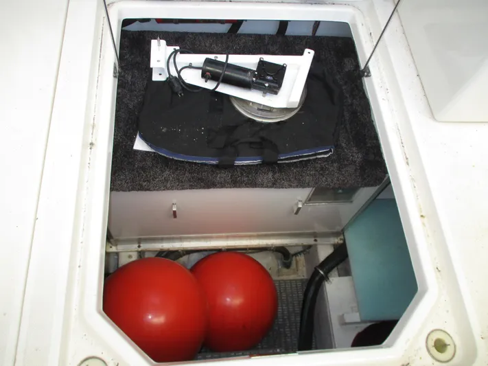 Spice Yacht Photos Pics 2000 Bayliner 5288 Pilot House storage compartment with red buoys and equipment.