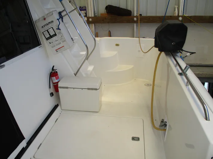 Spice Yacht Photos Pics 2000 Bayliner 5288 Pilot House boat deck with safety equipment and storage.