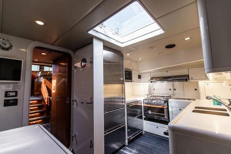Cabochon Yacht Photos Pics Interior of 2004 Ta Chiao Custom Pilothouse Cutter, featuring modern kitchen and skylight.
