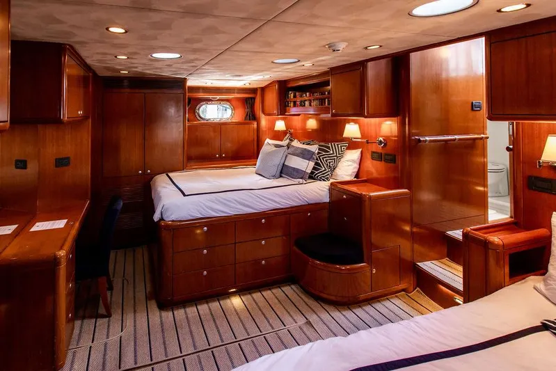 Cabochon Yacht Photos Pics Luxurious 2004 Ta Chiao Custom Pilothouse Cutter cabin with elegant wood interior and cozy bedding.