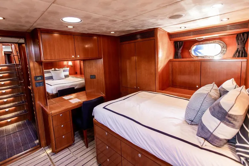 Cabochon Yacht Photos Pics Luxurious 2004 Ta Chiao Custom Pilothouse Cutter cabin with elegant wood interior and cozy bedding.