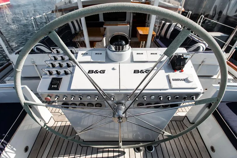 Cabochon Yacht Photos Pics Steering wheel and control panel of 2004 Ta Chiao Custom Pilothouse Cutter yacht.