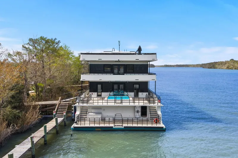 Shine Down Yacht Photos Pics Luxury Breaux Brothers 120 GLV yacht docked on serene lake, 2025 model.