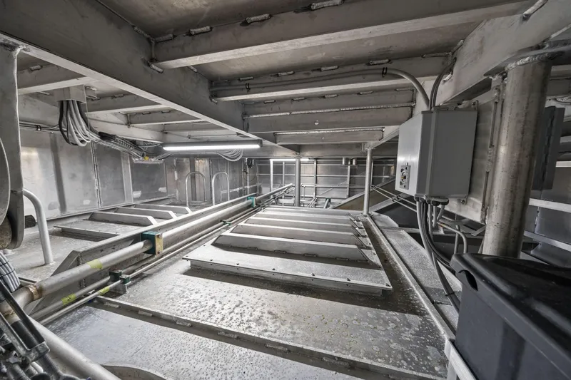 Shine Down Yacht Photos Pics Interior of 2025 Breaux Brothers 120 GLV vessel, showcasing industrial piping and electrical systems.